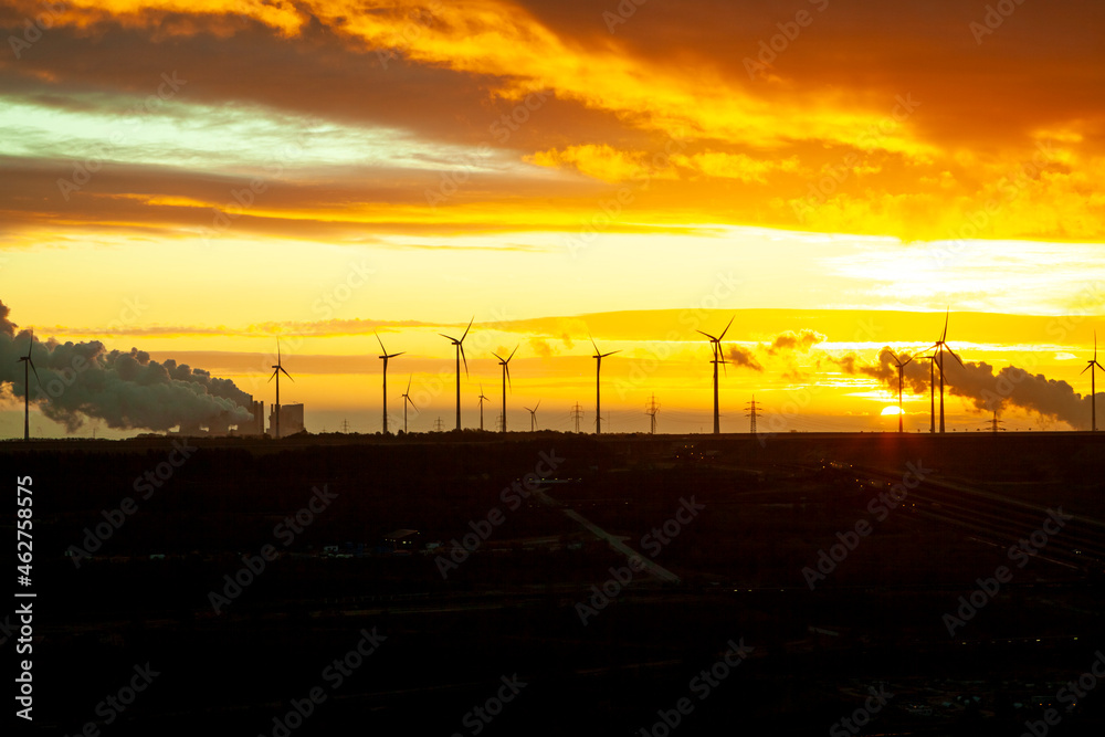 Garzweiler brown coal mining at sunrise with wind park in the background, Juechen, Germany Garzweiler brown coal mining at sunrise with wind park in the background, Juechen, Germany