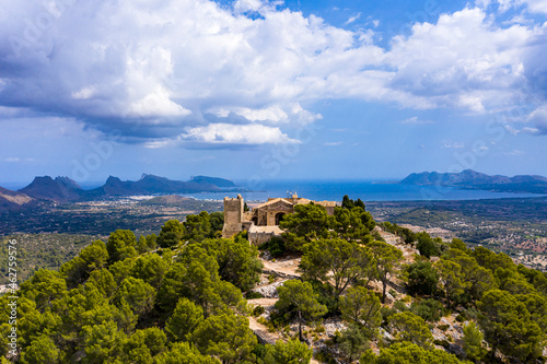 Spain, Balearic Islands, Majorca, Pollena, Town and Santuario del Puig de Maria, aerial view photo