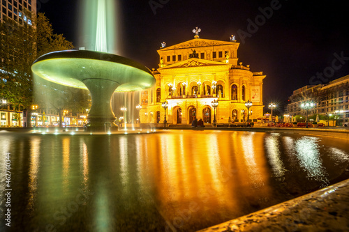 Germany, Hesse, Frankfurt, Fountain in front of Alte Oper at night photo