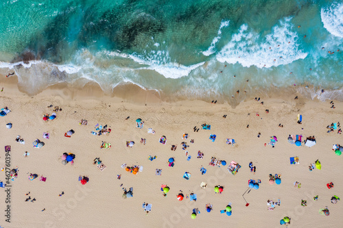 Spain, Mallorca, Cala Mesquida, Aerial view of people relaxing on Cala Agulla beach in summer photo