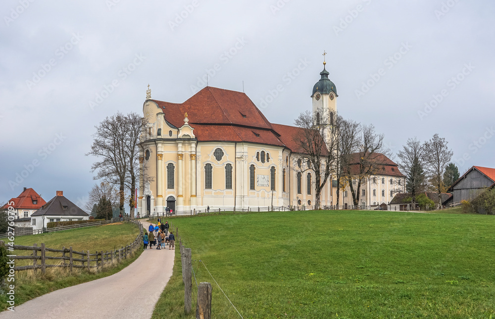 Germany, Bavaria, Steingaden, Lawn and country road in front of Pilgrimage Church of Wies Germany, Bavaria, Steingaden, Lawn and country road in front of Pilgrimage Church of Wies