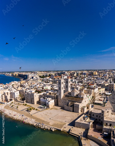 Italy, Province of Bari, Molfetta, Drone view of Church of Saint Conrad and surrounding houses in summer photo