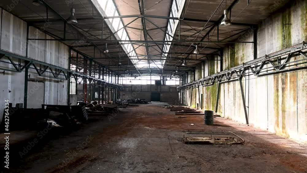 Abandoned industrial complex. Empty hall in former factory. Inside of damaged industrial halls. Abandoned industrial complex. Empty hall in former factory. Inside of damaged industrial halls.