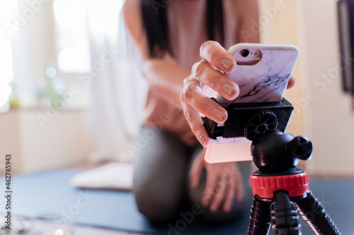Mature woman with smartphone in attachment