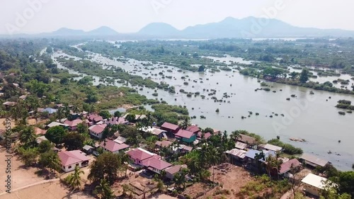 Flying over a remote rural village, Don Det, in fourthousand islands in Laos photo