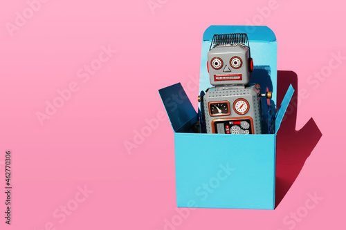 Studio shot of vintage robot toy in turquoise gift box photo