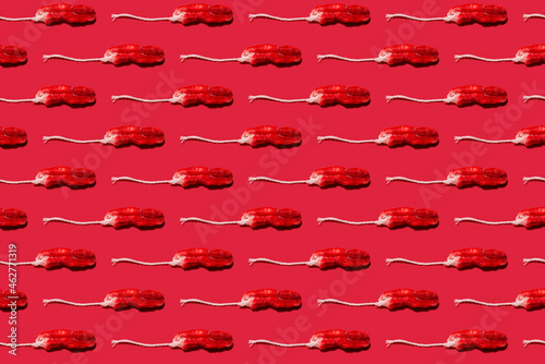 Pattern of used tampons against red background