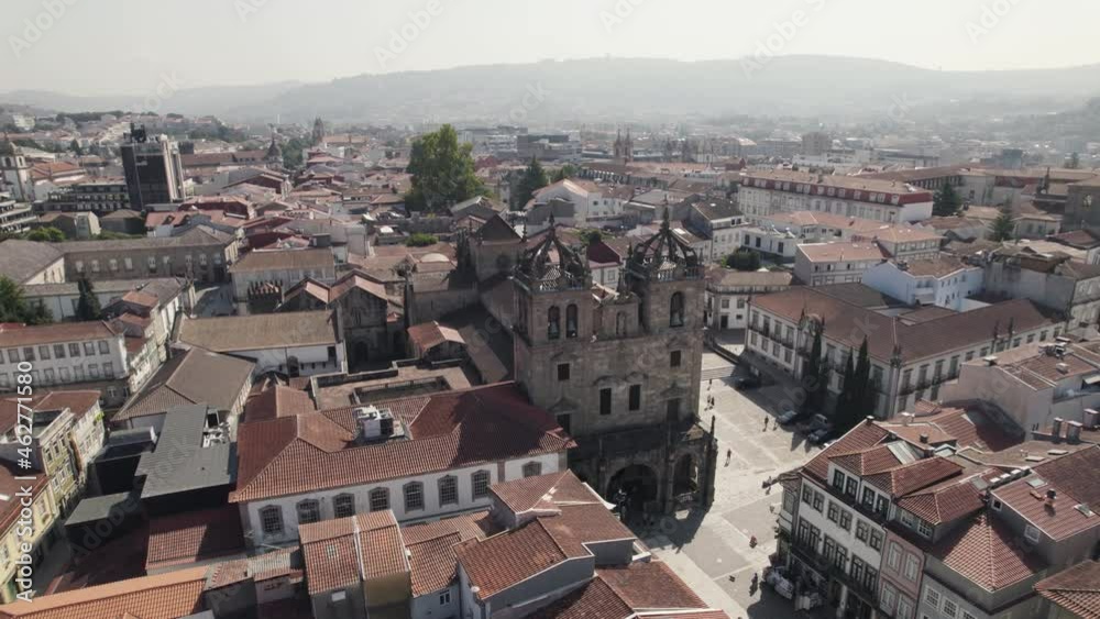 Aerial backwards view of the Romanic cathedral in the historic center of Braga. Portugal. Real time Aerial backwards view of the Romanic cathedral in the historic center of Braga. Portugal. Real time