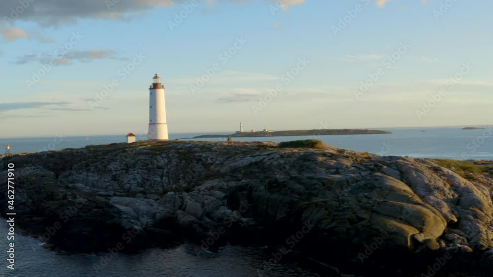 Lille Torungen Lighthouse - Coastal Lighthouse On The Island Of Lille Torungen, Arendal, Agder County, Norway - aerial drone shot