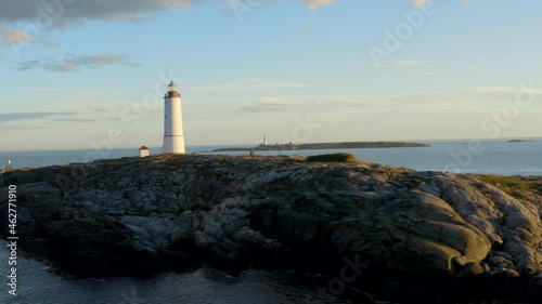 Lille Torungen Lighthouse - Coastal Lighthouse On The Island Of Lille Torungen, Arendal, Agder County, Norway - aerial drone shot photo