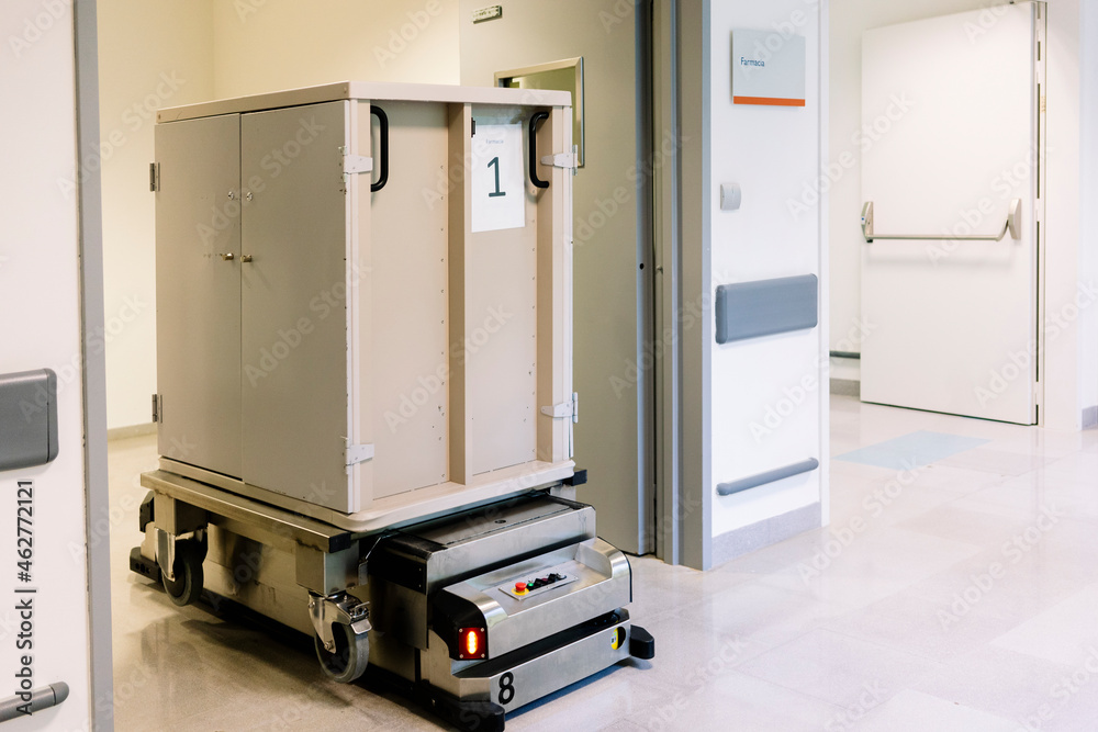 Metallic container on robotic trolley moving in hospital Metallic container on robotic trolley moving in hospital