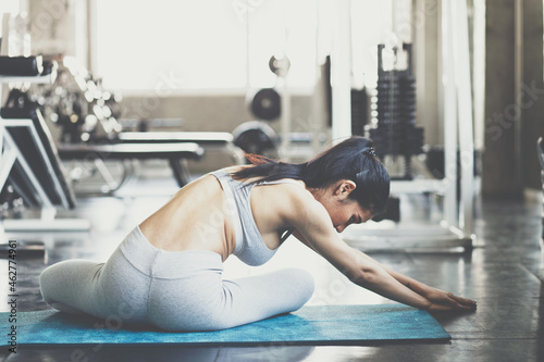 Women stretching body before exercise in sport gym