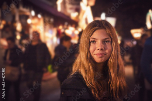 Wallpaper Mural Portrait of blond girl at carnival in city during night. Munich, Germany Torontodigital.ca