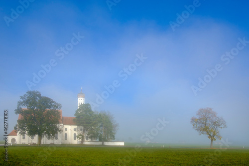 Germany, Bavaria, Schwabia, Schwangau, View to pilgrimage church St. Coloman and fog photo