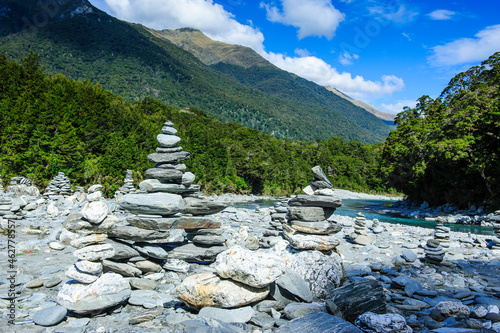 Man made stone pyramids at the Blue Pools, Haast Pass, South Island, New Zealand photo