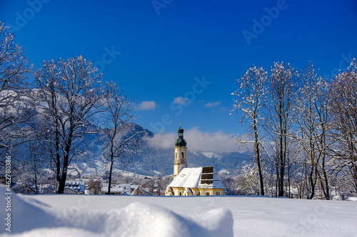 Germany, Isarwinkel, Lenggries, view to parish church Sankt Jakob in winter photo
