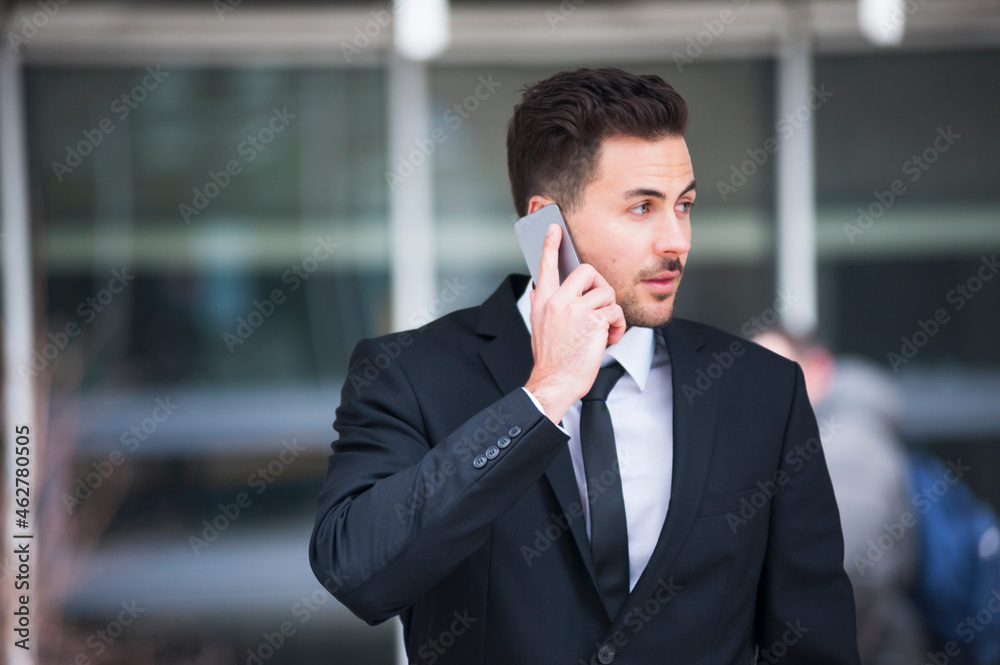 Businessman using smart phone outdoors Businessman using smart phone outdoors
