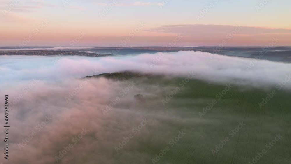 Scenic top view on foggy rural landscape. Cinematic drone shot. Scenic top view on foggy rural landscape. Cinematic drone shot.