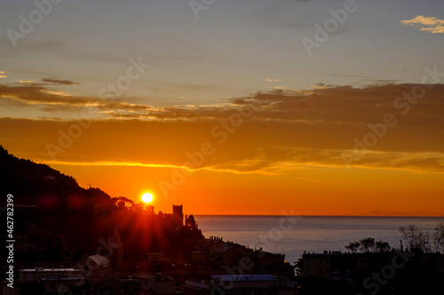 Italy, Liguria, Riviera di Ponente, Finale Ligure, Town and sea at sunrise photo