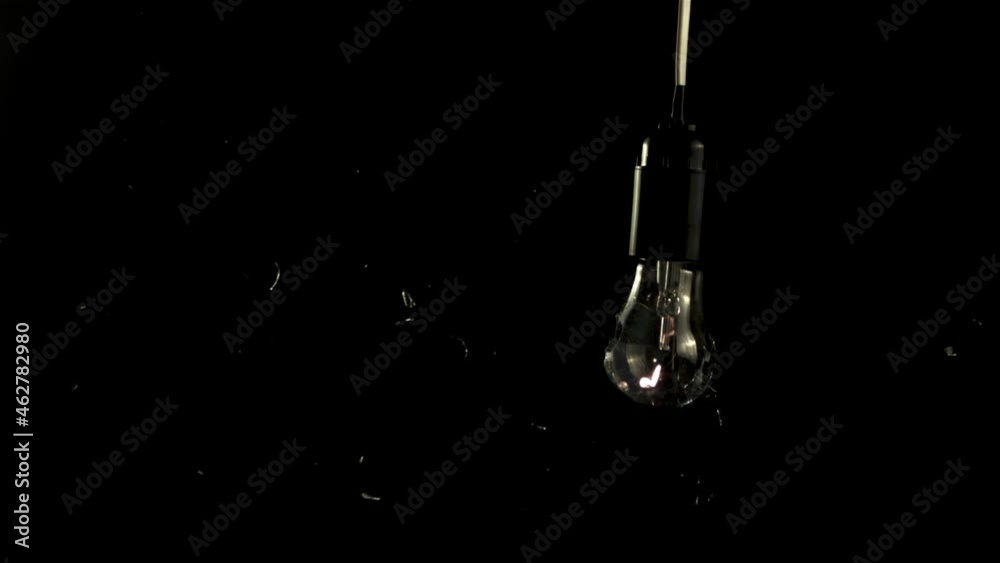 Super slow motion light bulb crashed with shards of glass. On a black background. High quality FullHD footage Super slow motion light bulb crashed with shards of glass. On a black background. High quality FullHD footage