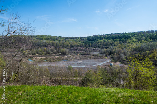 Germany, Hesse, Messel, Messel Pit quarry with forest in background photo