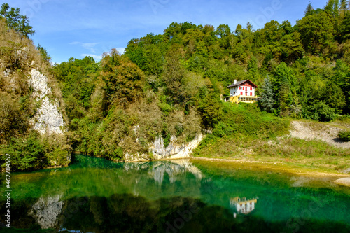 France, Pyrenees-Atlantiques, Sainte-Engrace, Lake and secluded house in Les GorgesÔøΩdeÔøΩKakuettaÔøΩnature reserve photo