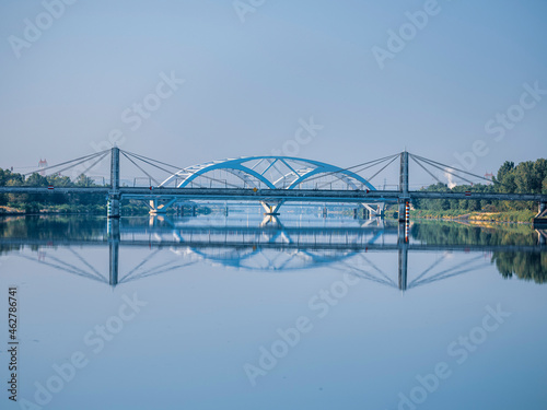 France, Vaucluse, LGV bridge reflecting in river Rhone photo