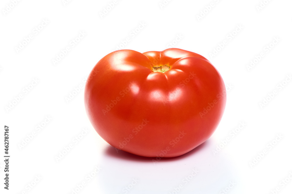 Juicy red tomato on a white isolated background Juicy red tomato on a white isolated background