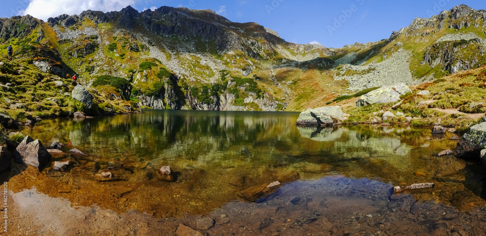 gorgeous colors at a mountain lake in the summer panorama