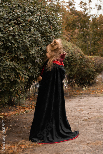 a girl in a witch costume for Halloween depicts fear and horror