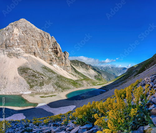 Italy, Umbria, Sibillini mountain range, Mount Vettore, Lake Pilato and mount Pizzo del Diavolo in Summer photo