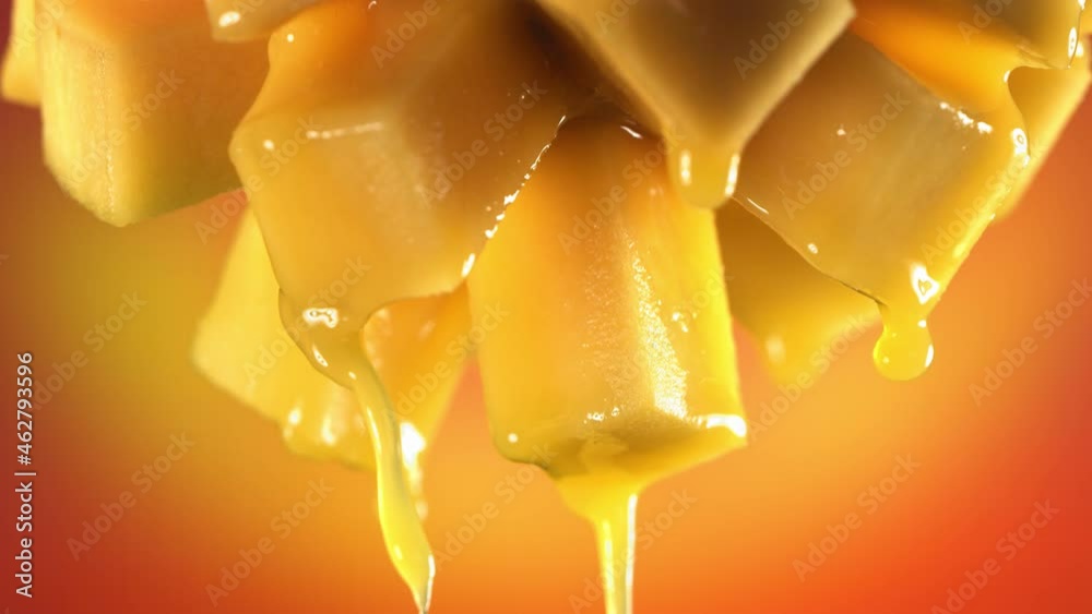 Flowing Mango Juice from half slide Mango , macro shot in slow motion