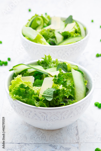 High angle view of fresh salad in bowls on tiled floor