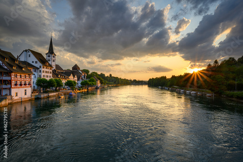 Switzerland, Canton of Thurgau, Diessenhofen, High Rhine and adjacent village at moody sunset