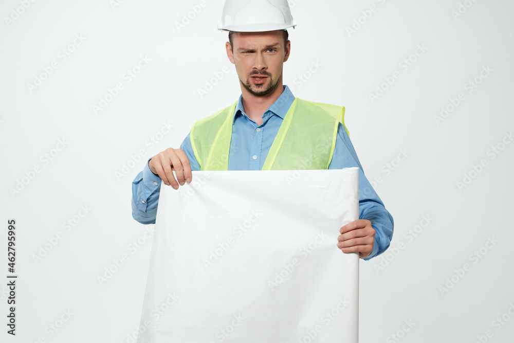 man in white helmet blueprints builder Working profession man in white helmet blueprints builder Working profession