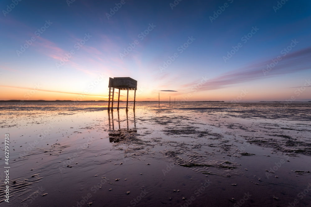 United Kingdom, England, Northumberland, posts marking the pilgrims' way crossing to Lindisfarne with emergency refuge, sunrise United Kingdom, England, Northumberland, posts marking the pilgrims' way crossing to Lindisfarne with emergency refuge, sunrise