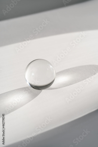 Transparent crystal ball on a white background. © Marevgenna