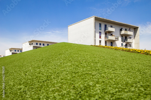 Germany, Bavaria, Munich, Green lawn in front of residential buildings inÔøΩTheresienpark photo