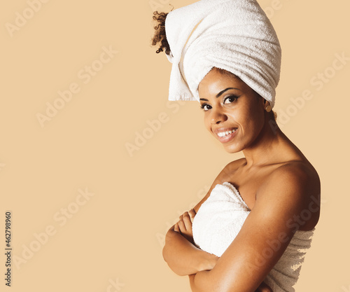 pretty afro girl with body towel and towel in hair