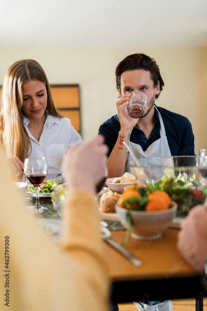 Friends having fun, eating lunch together Friends having fun, eating lunch together