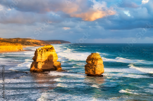 Stack rocks in sea cloudy sky at Gibsons Steps, Victoria, Australia photo