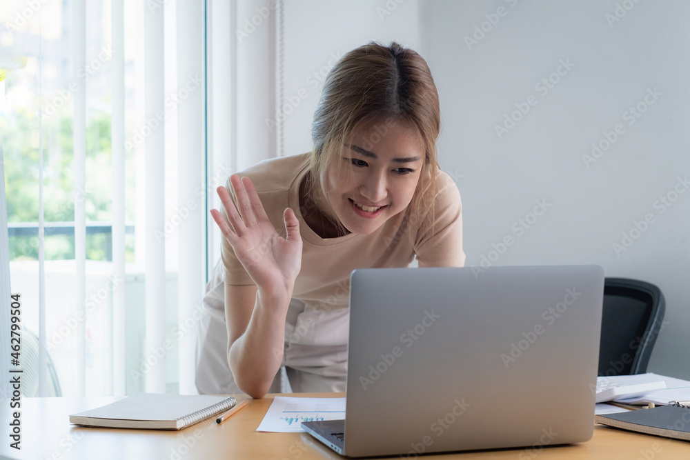 Businesswoman in having a video call on laptop while discussion with business partner during work from home. Businesswoman in having a video call on laptop while discussion with business partner during work from home.