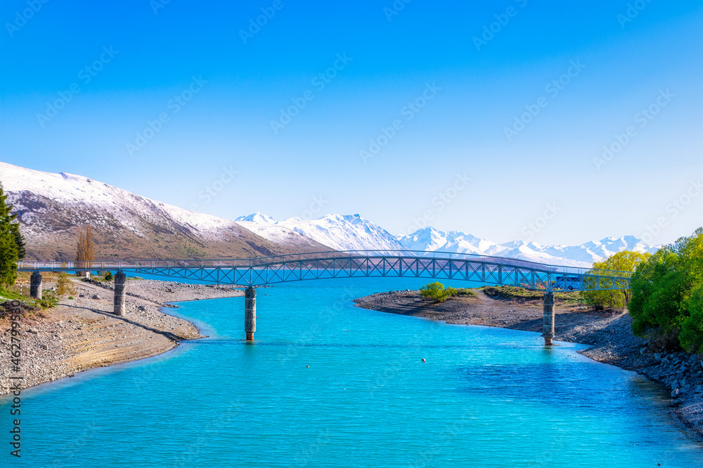 Bridge over Lake Tekapo against blue sky, Tekapo, South Island, New Zealand Bridge over Lake Tekapo against blue sky, Tekapo, South Island, New Zealand