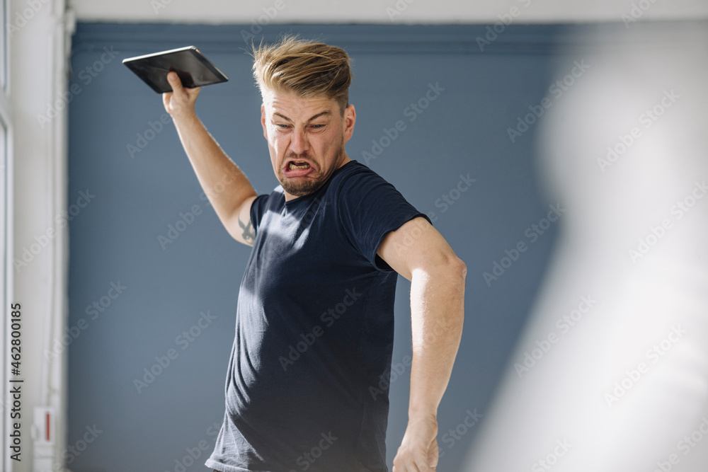 Angry man throwing tablet away Stock Photo Adobe Stock