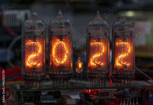 retro Nixie lamp indicator clock on dark background 2022 number