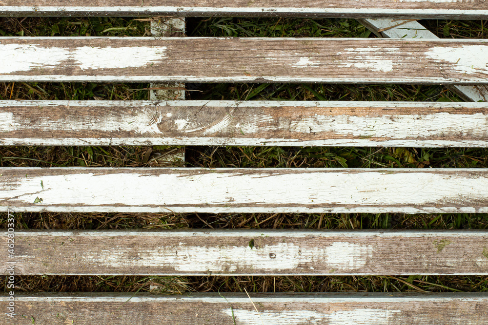 Wooden trellis or flooring on the ground as a background. Wooden trellis or flooring on the ground as a background.