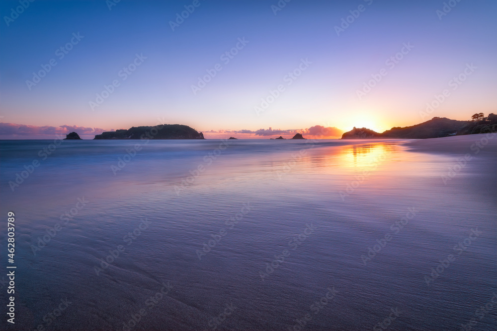 New Zealand, Waikato, Hahei, Long exposure ofÔøΩMercury BayÔøΩat purple sunrise New Zealand, Waikato, Hahei, Long exposure ofÔøΩMercury BayÔøΩat purple sunrise