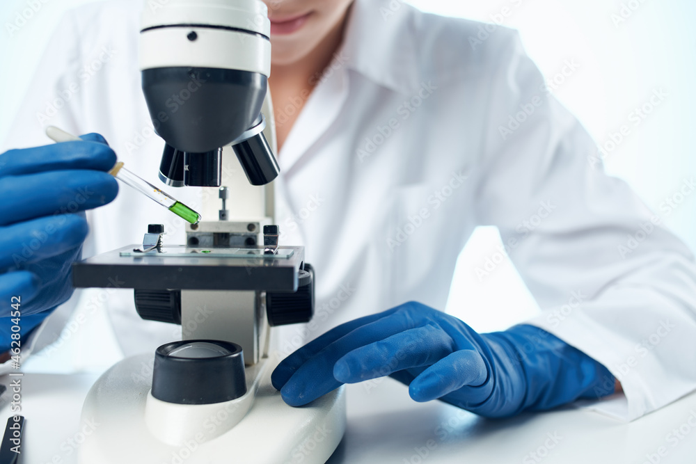 female doctor sitting at the table microscope research isolated background female doctor sitting at the table microscope research isolated background
