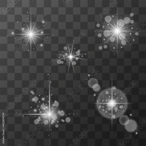 Set of glowing flashes of light with sparkles on a transparent background.