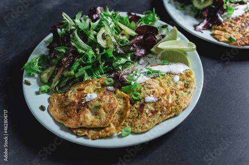 Vegetable cheese fritter with salad on plate